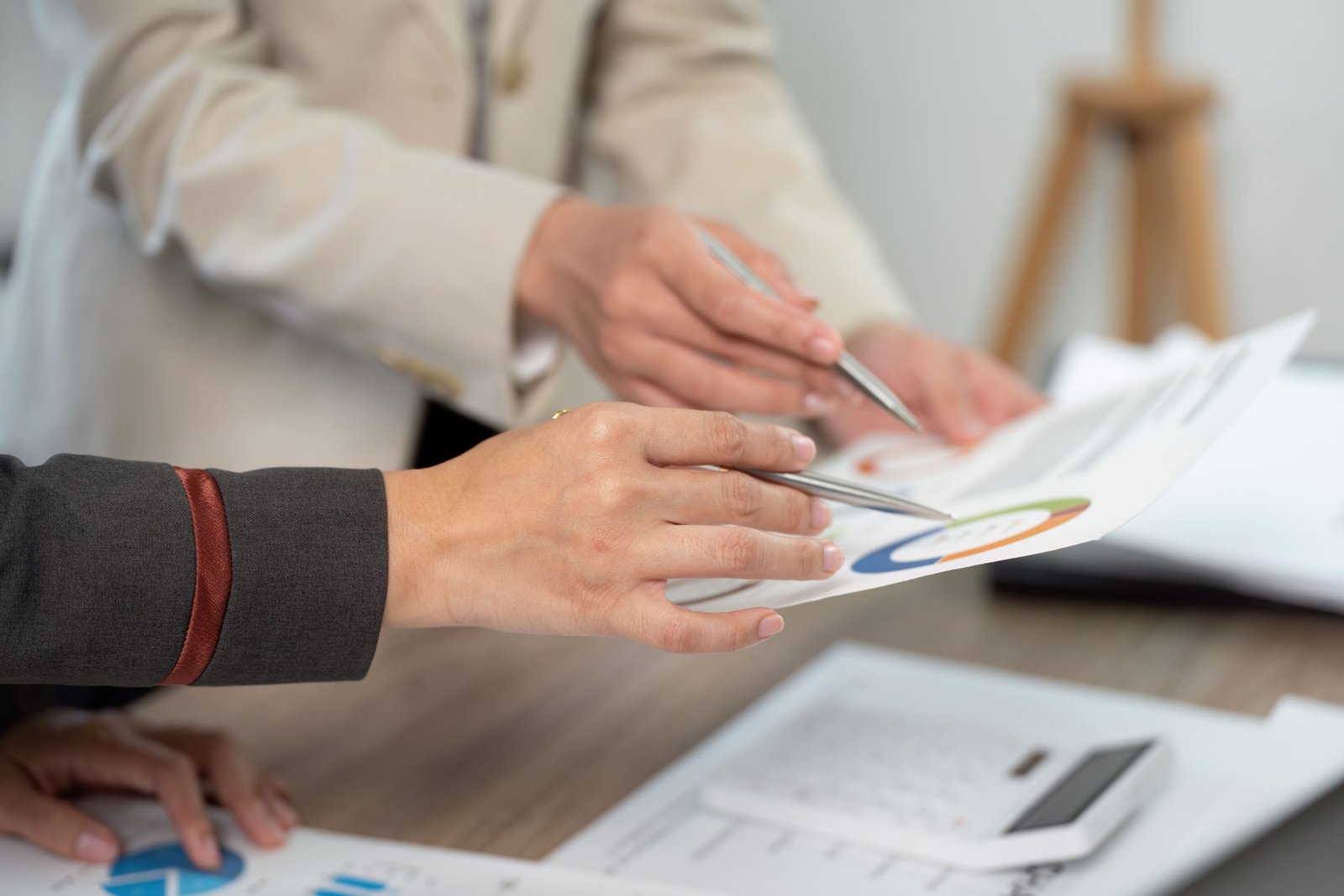 gallery-06 vecteezy-hands-of-business-professionals-reviewing-project-reports-66680104